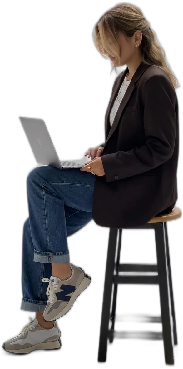 Shopify developer working on a laptop, building an ecommerce store